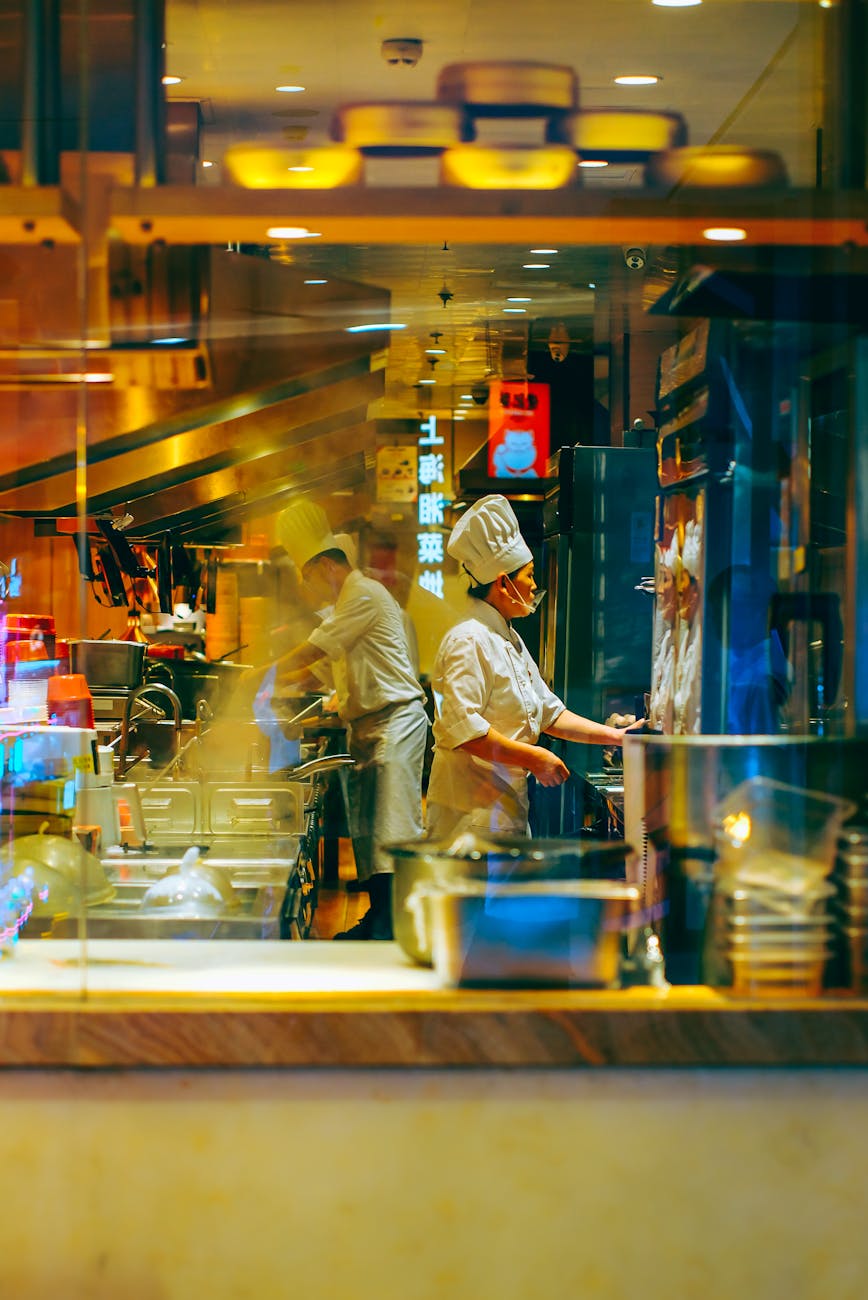 chefs working in a busy restaurant kitchen